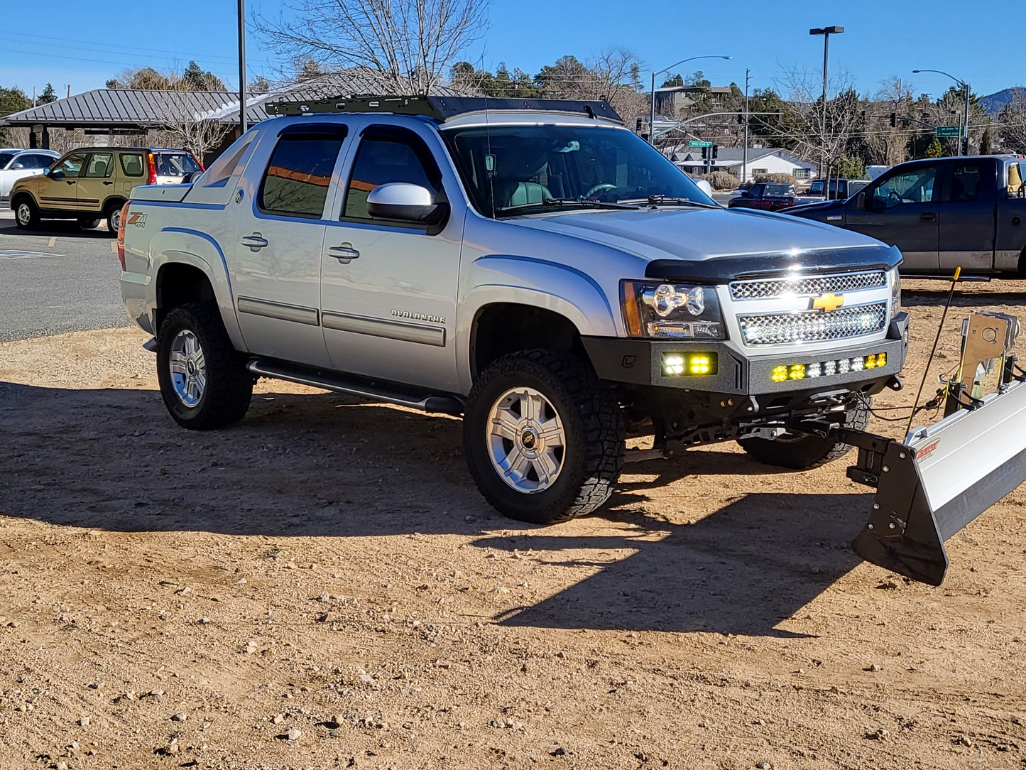 Reliable 2007-2014 Chevrolet Avalanche roof rack with Baseline Overland, winch bumper, baja designs squadron sport and snow plow