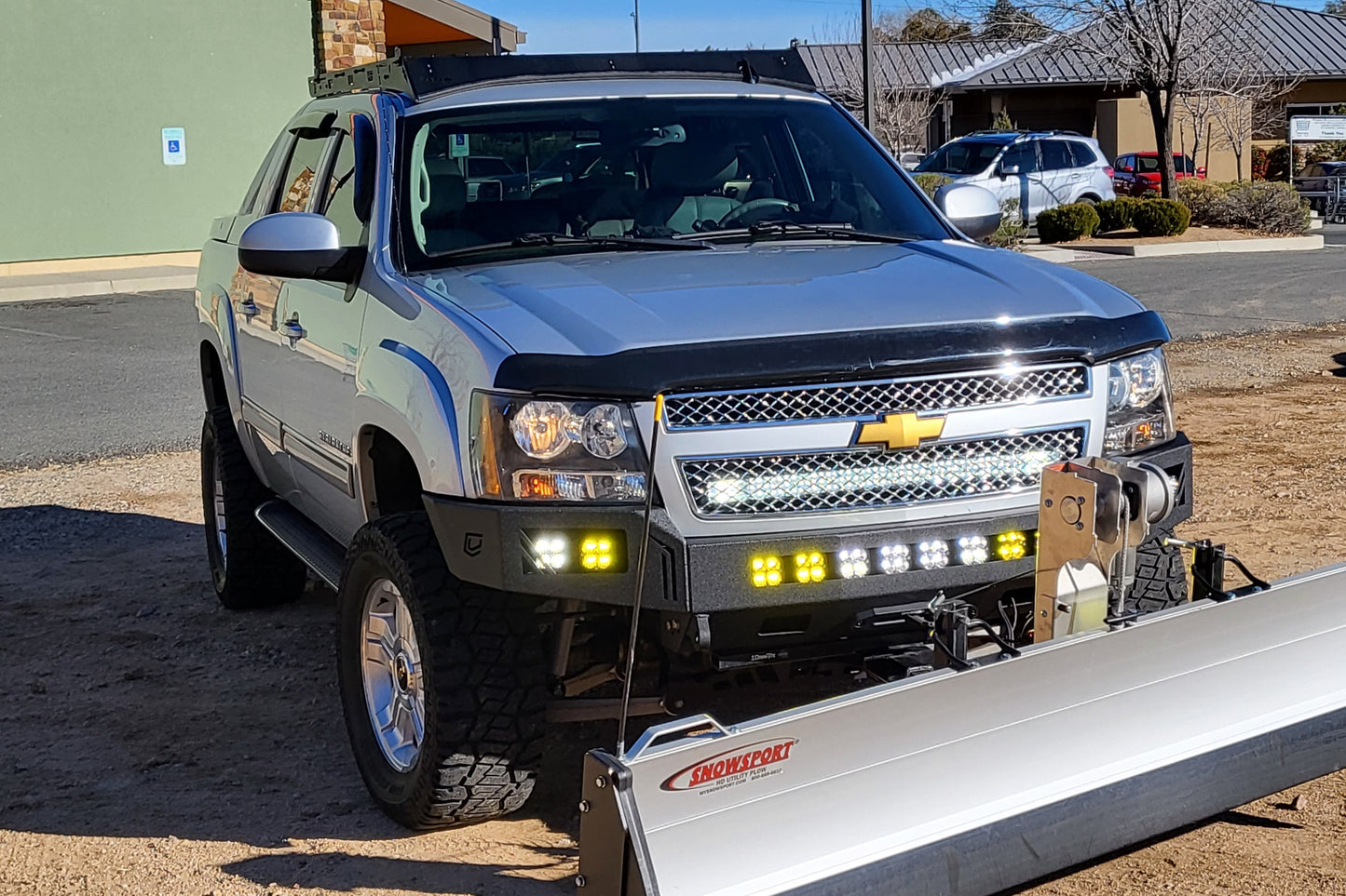 Chevy Avalanche with Baseline Overland Roof Rack, winch bumper, baja designs squadron sport and snow plow