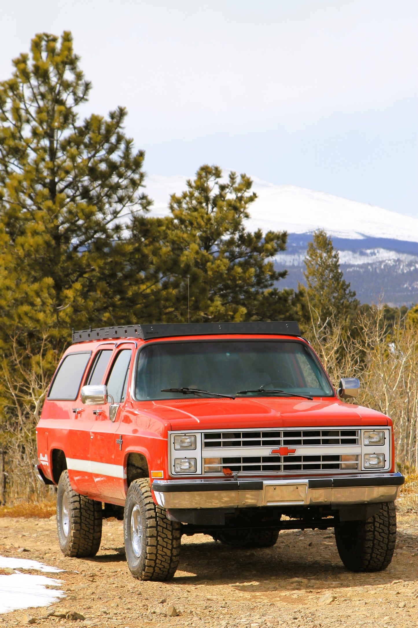 Red 1987 Chevy Suburban with Baseline Overland Roof Rack