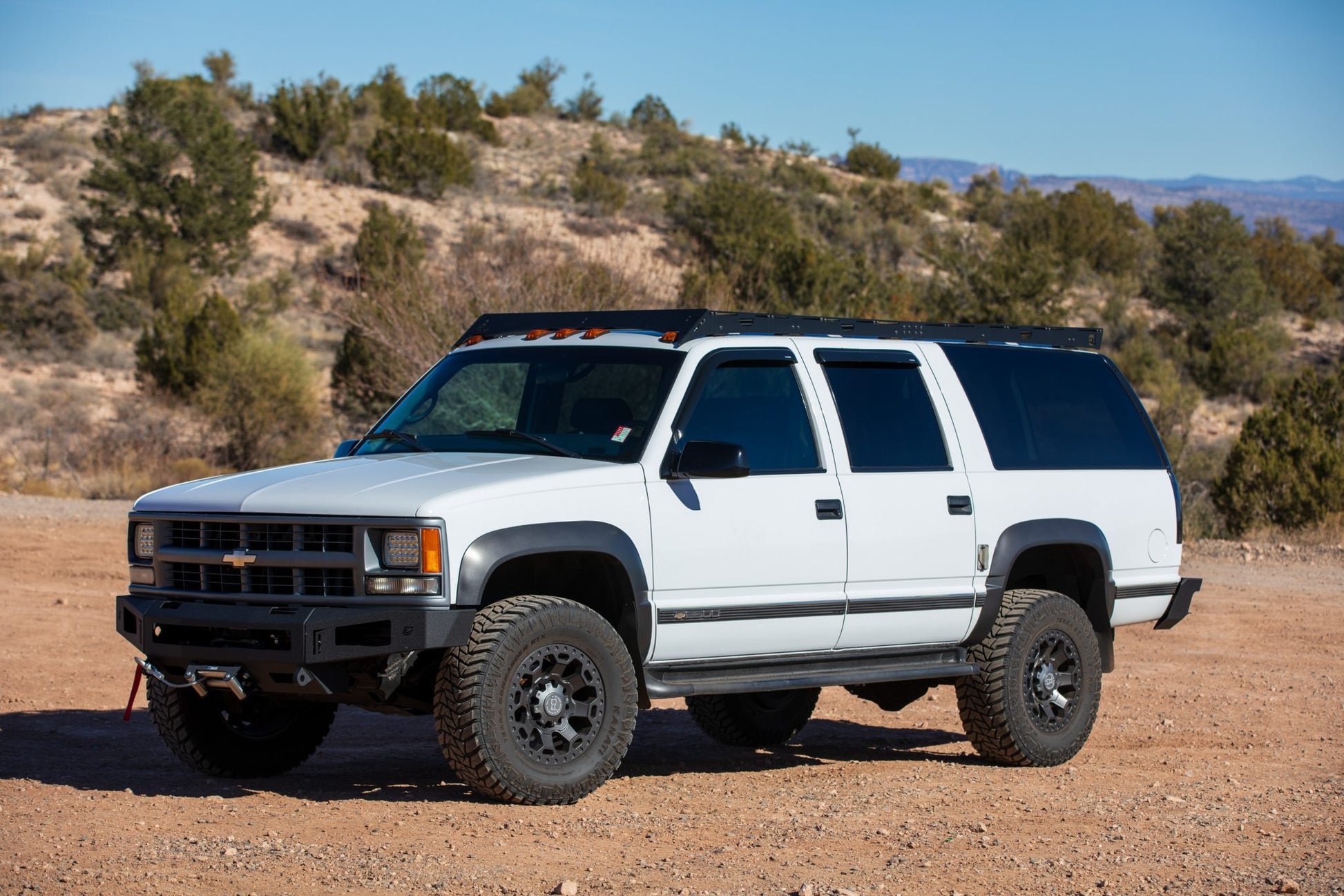 1992-1999 Chevrolet Suburban with roof rack  and Winch Bumper and rear bumper from Baseline Overland.