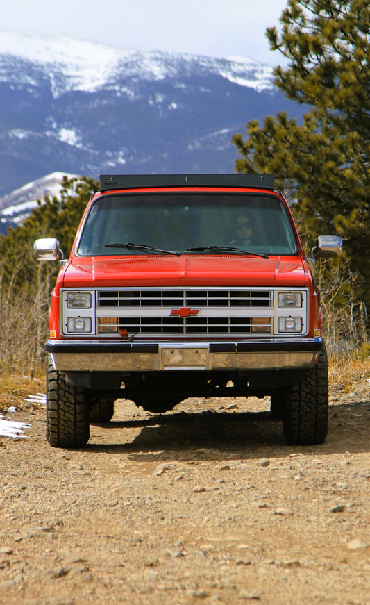 Red 1987 Chevy Suburban with Baseline Overland Roof Rack with standard fairing