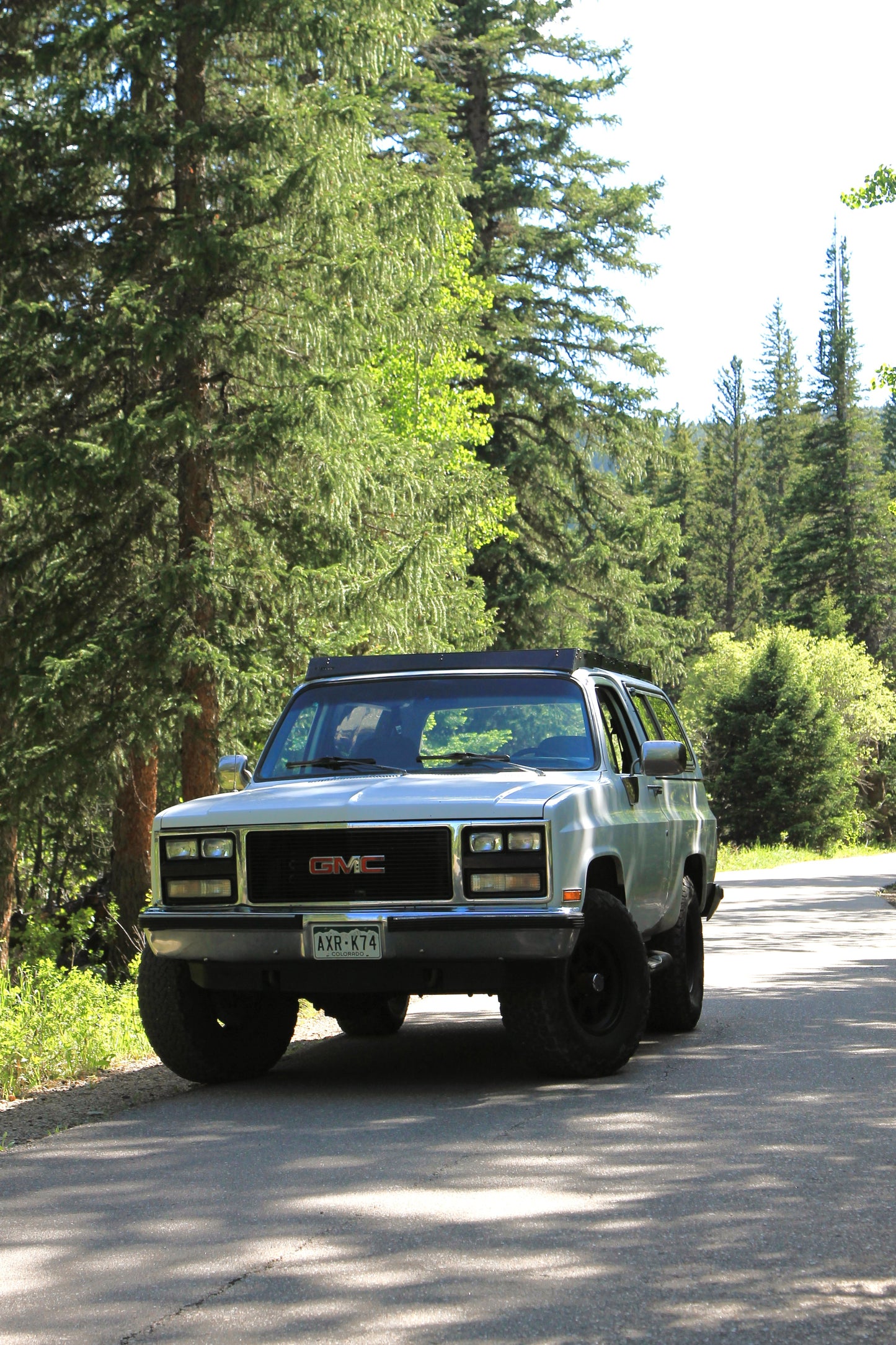 White Square Body Blazer with Black Roof Rack from Baseline Overland and 35 inch tires on Method Race Wheels