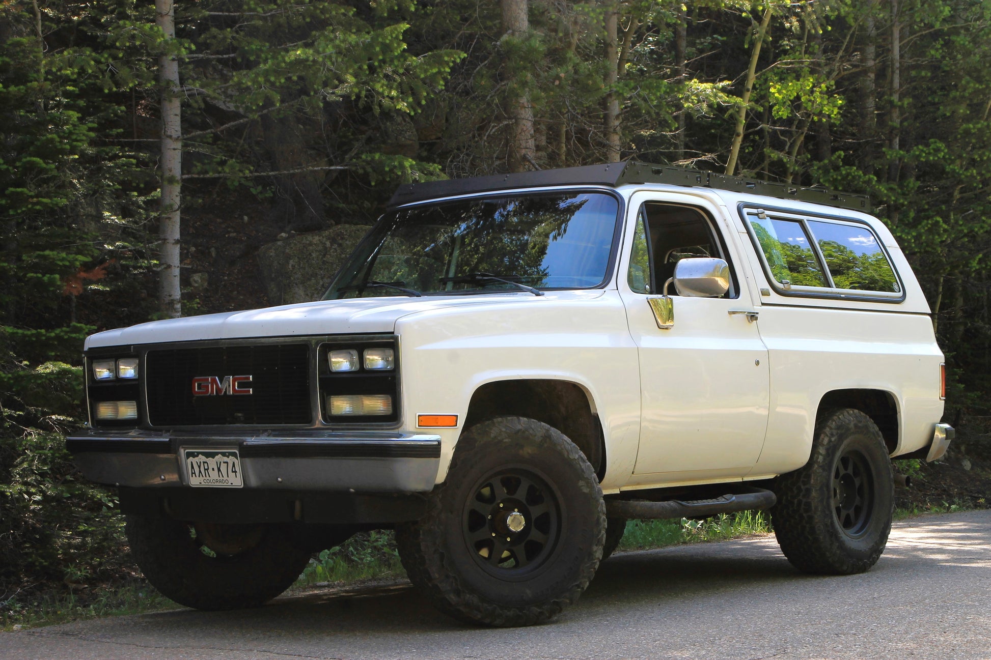 White Square Body Blazer with Black Roof Rack from Baseline Overland and 35 inch tires on Method Race Wheels