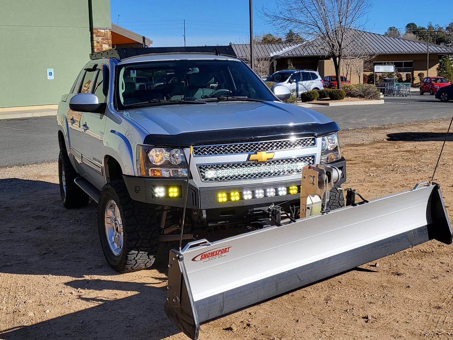 Chevy Avalanche with Baseline Overland Roof Rack, winch bumper, baja designs squadron sport and snow plow