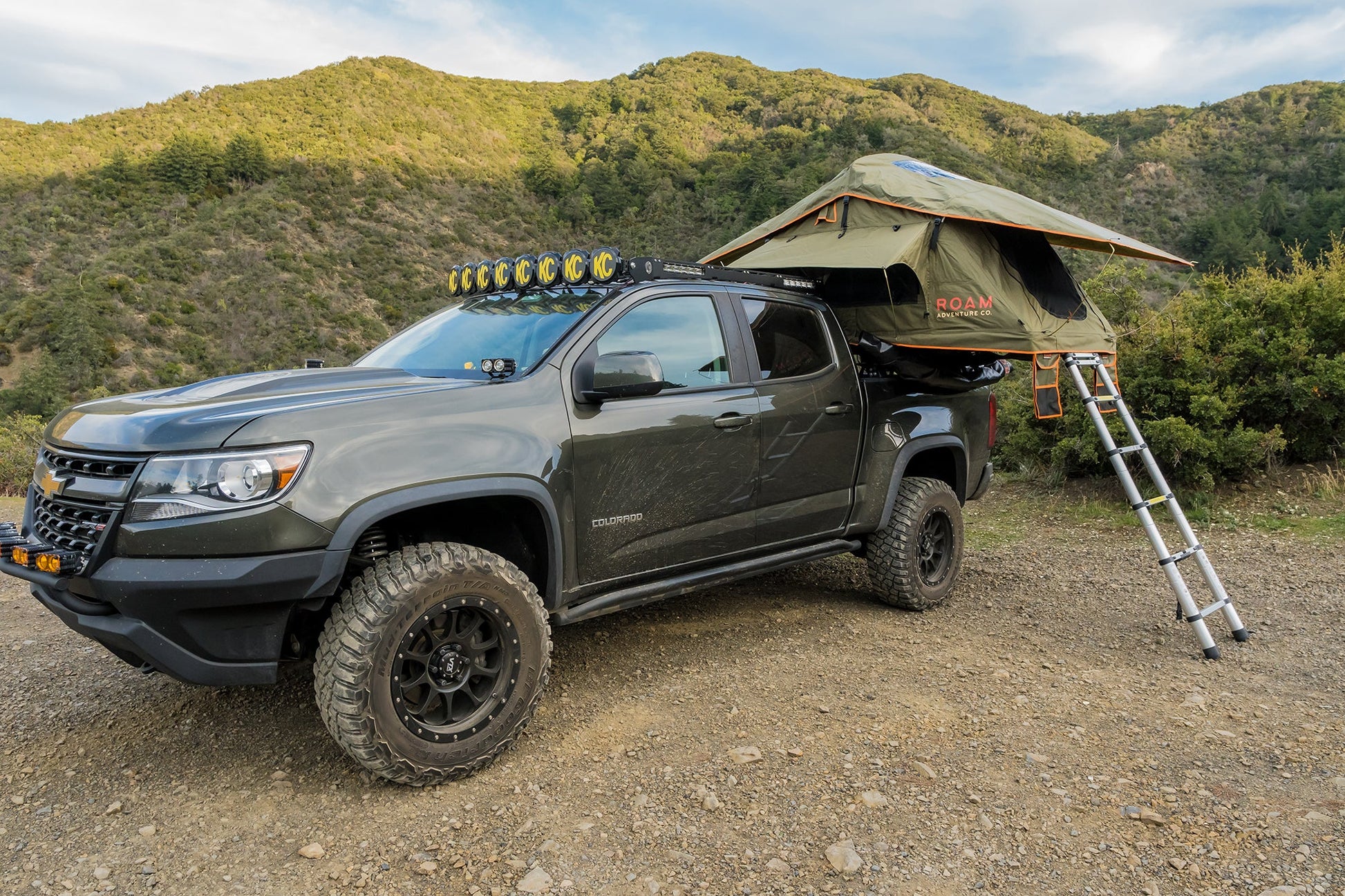 Vagabond Lite Rooftop Tent in Forest Green Hyper Orange on a Chevy Colorado Truck